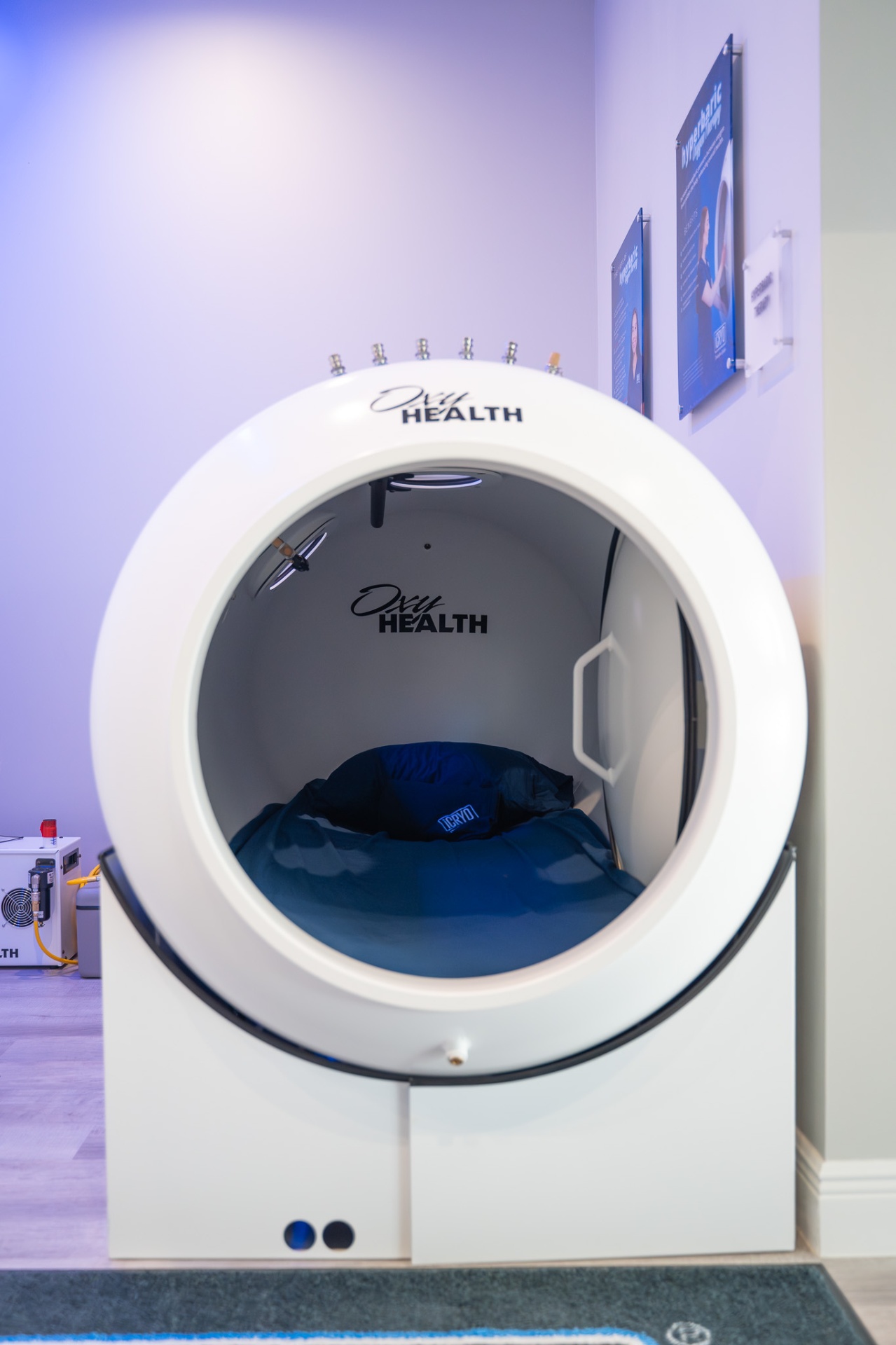 Guest relaxing in a hard-shell hyperbaric oxygen chamber for enhanced healing
