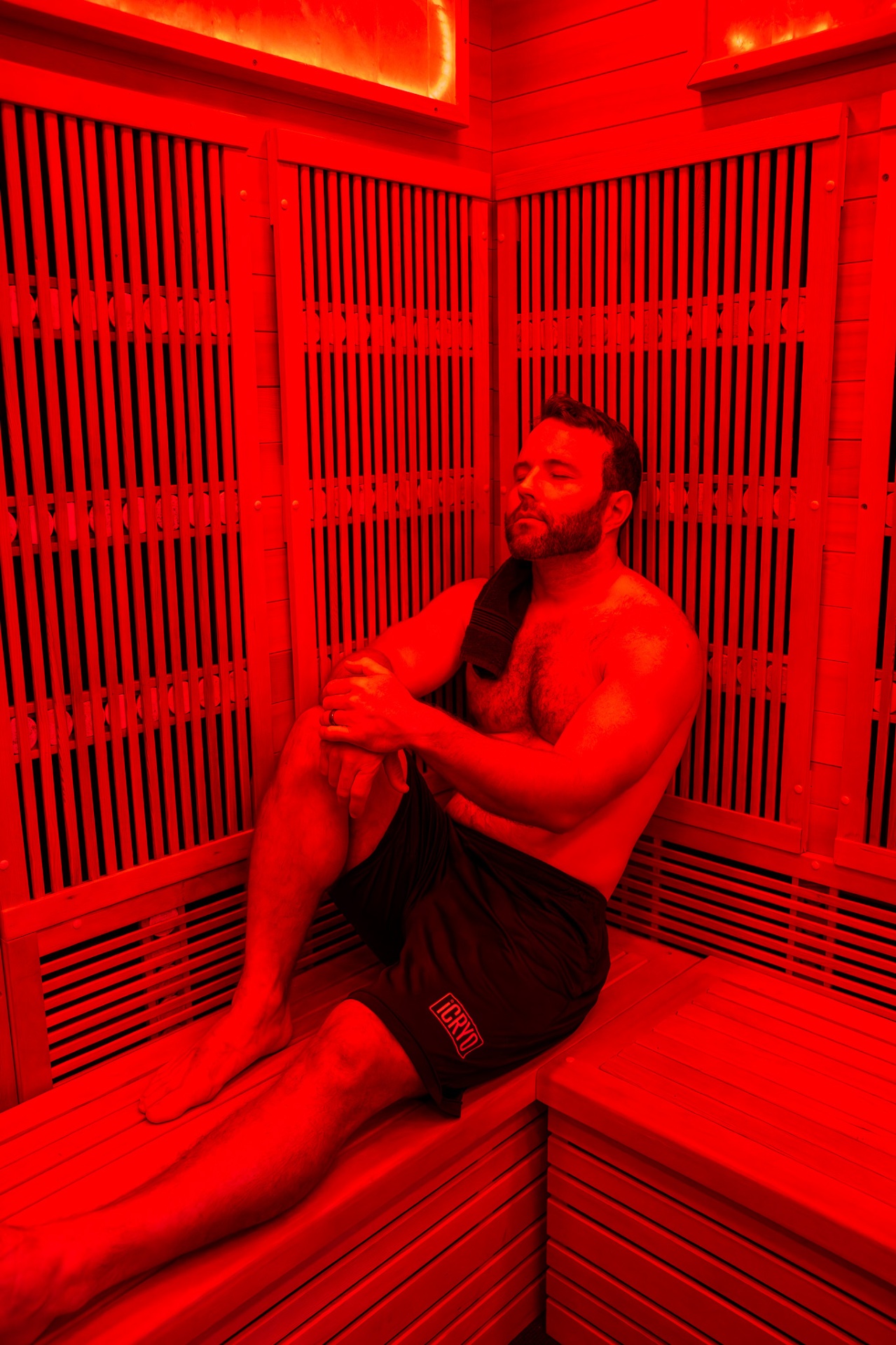Guest relaxing inside a full-spectrum infrared sauna at iCRYO Clemson